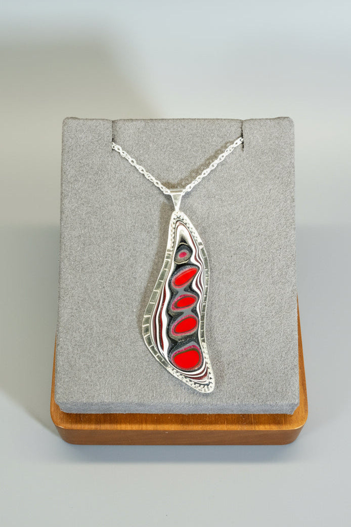 silver and fordite necklace in red and gray
