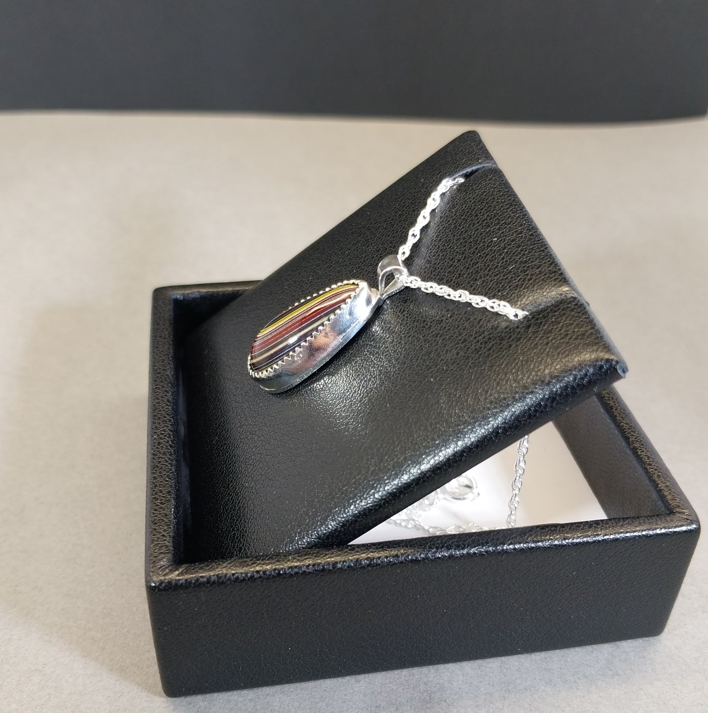 Corvetteite- Fordite Pendant in Solid Sterling Silver