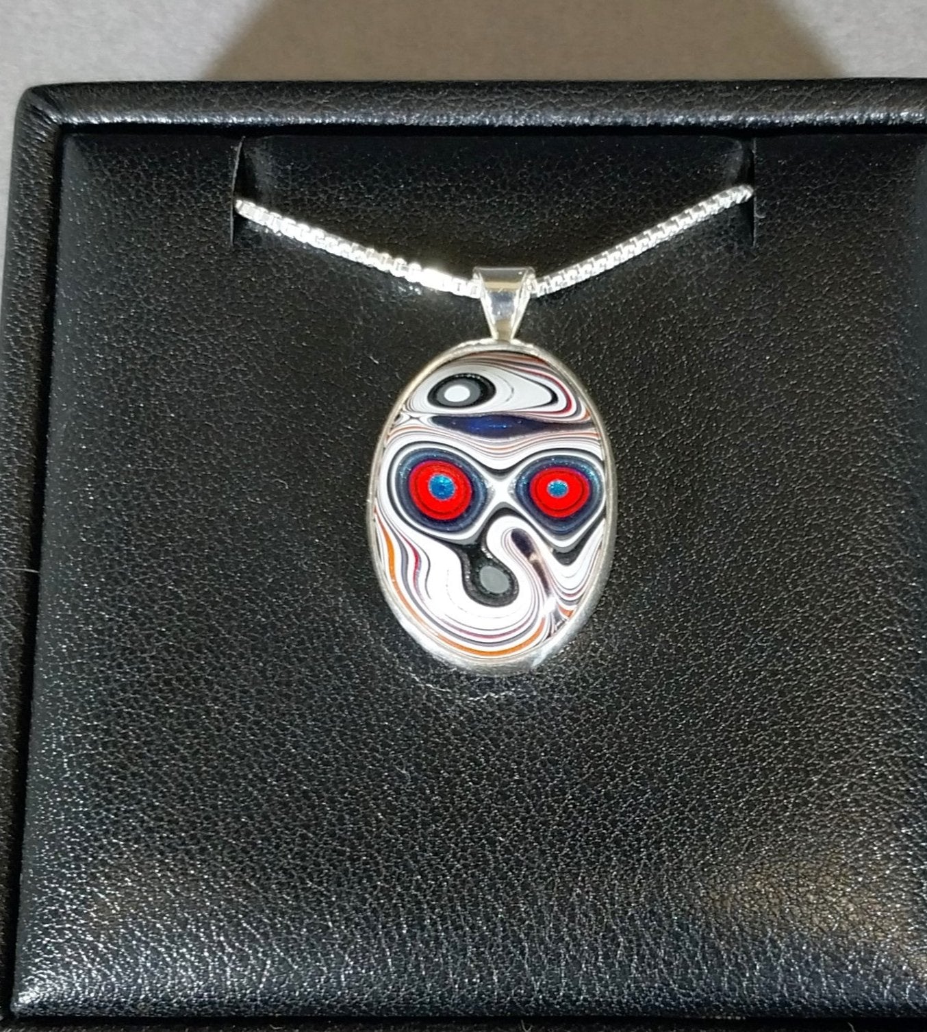 Fordite Necklace in Solid Silver Day of the Dead Skull Pattern