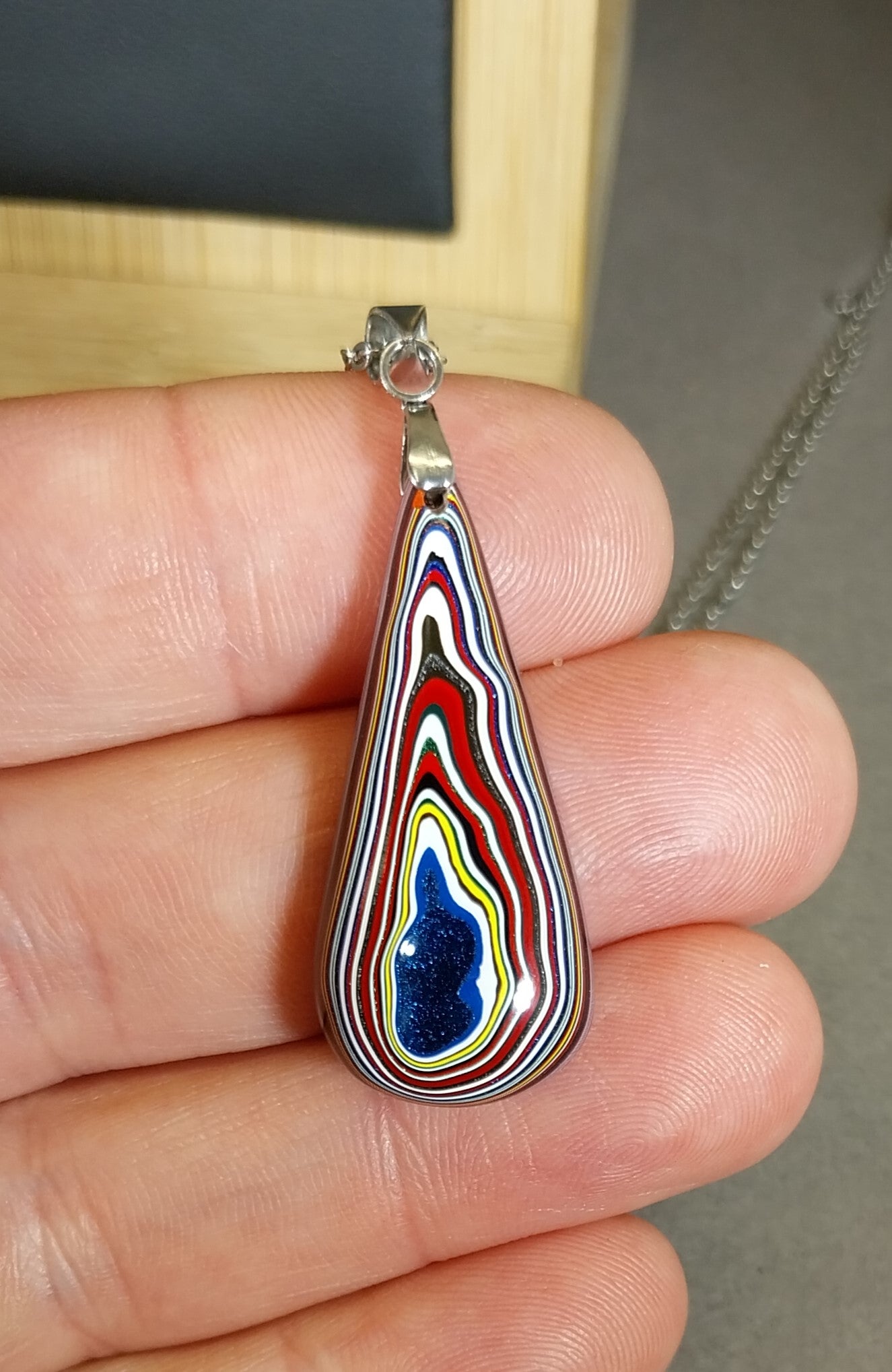 Fordite Necklace Lots of Red in an Elongated Teardrop