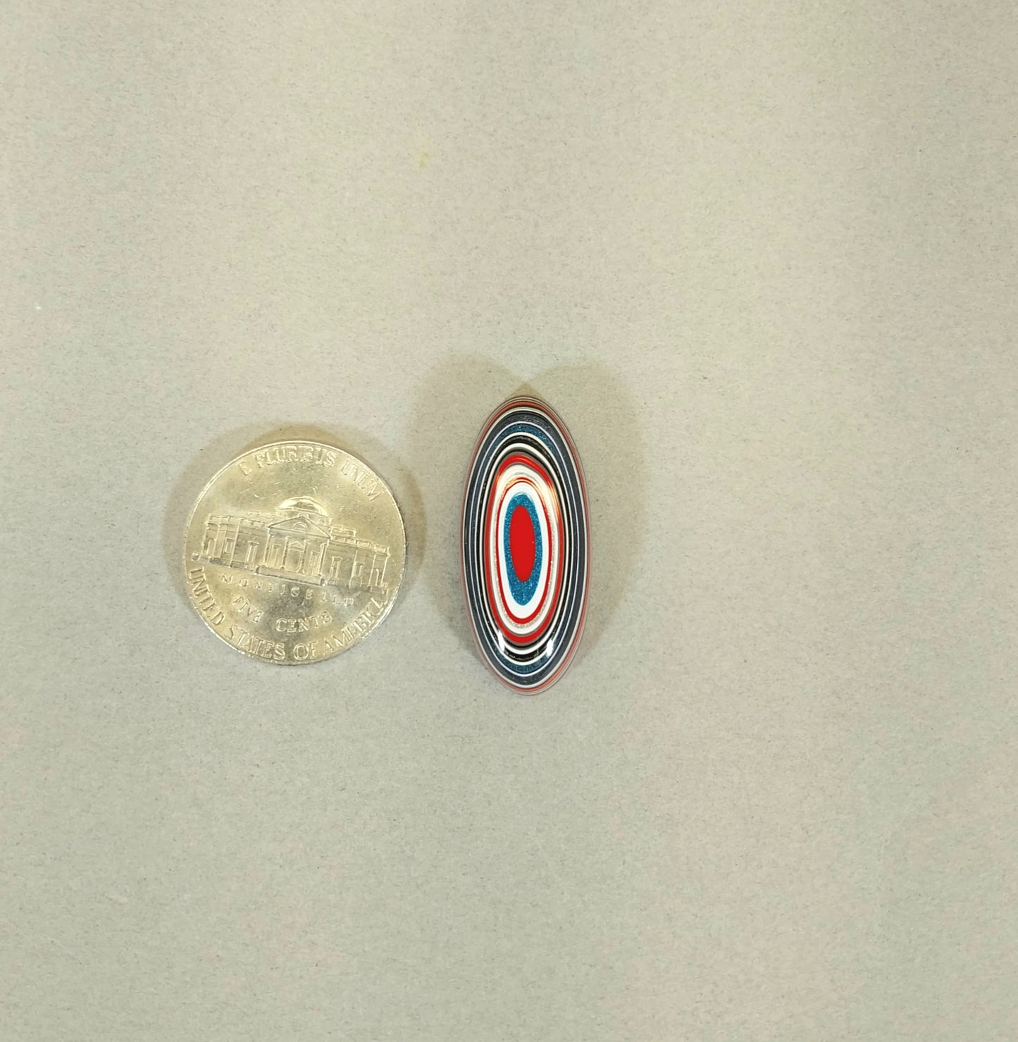 Oval Fordite Cabochon, Red White and Blue