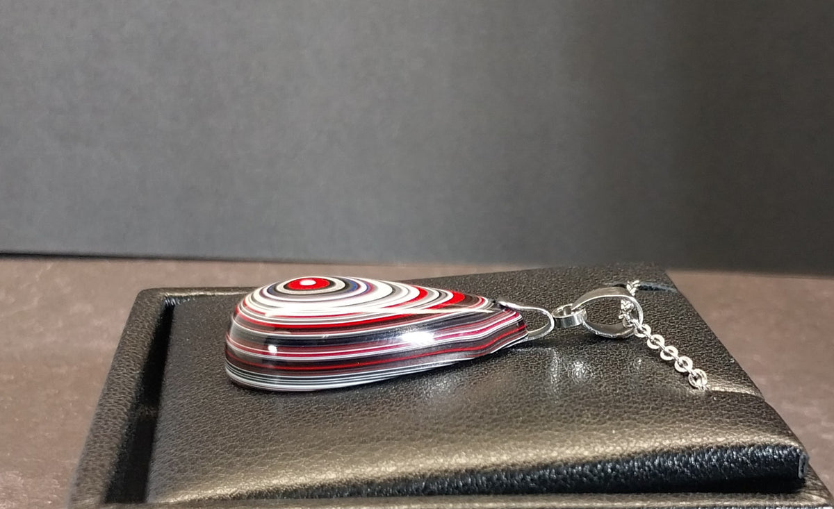 Fordite Necklace Great Colors in a Domed Teardrop