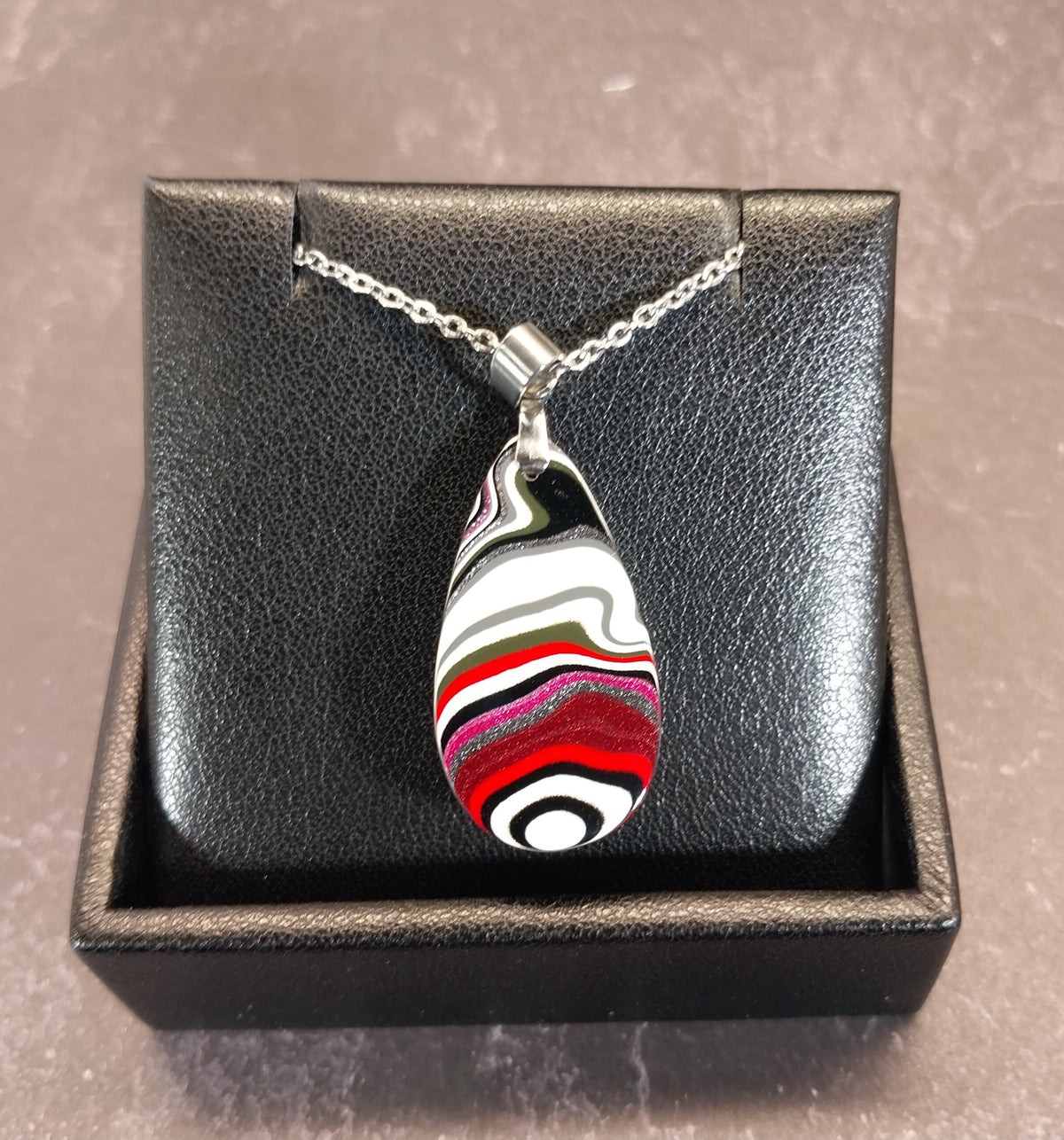 Fordite Necklace Great Colors in a Domed Teardrop